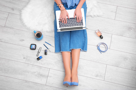 Woman using laptop at homeの写真素材