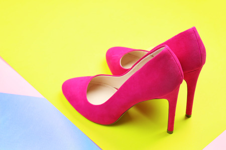 Pair of stylish shoes on color backgroundの写真素材