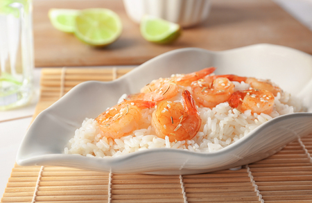 Plate with delicious shrimp fried rice on tableの写真素材