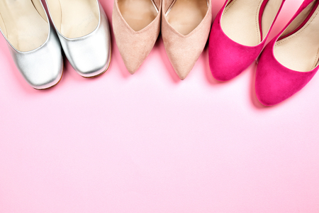 Female stylish shoes on color backgroundの写真素材