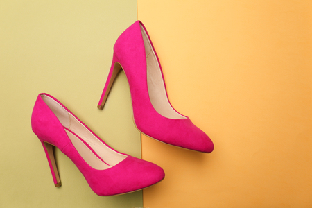 Pair of stylish shoes on color backgroundの写真素材