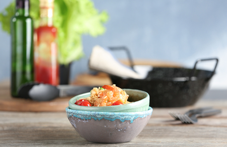 Bowls with delicious shrimp fried rice on tableの写真素材