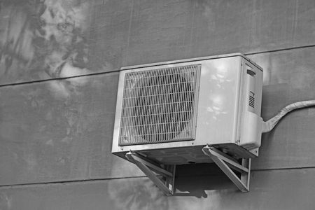 Air conditioner on wall of building, outdoorsの写真素材