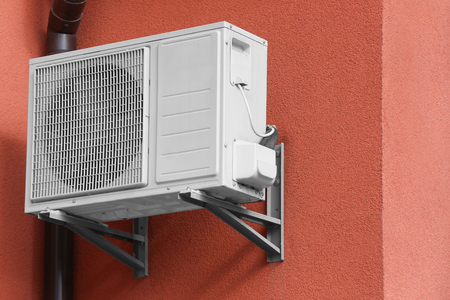 Air conditioner on wall of building, outdoorsの写真素材