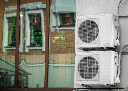 Air conditioners on wall of building outdoors
