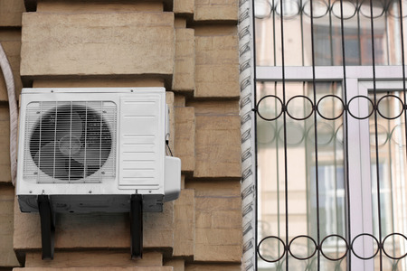 Air conditioner on wall of building, outdoors