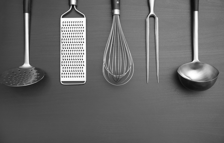 Different kitchen utensils on grey backgroundの写真素材