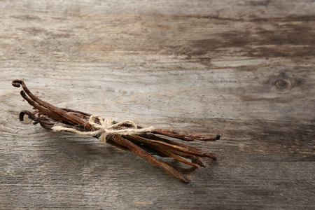 Dried vanilla pods on wooden backgroundの写真素材