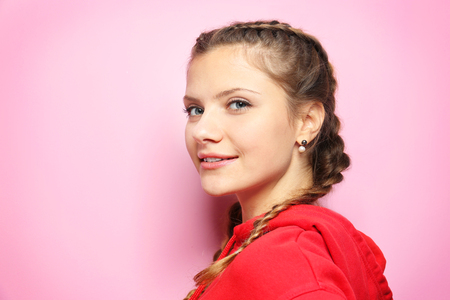 Young beautiful woman on color backgroundの写真素材