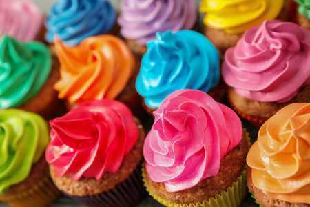 Tasty colorful cupcakes on tableの写真素材
