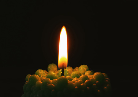 Beautiful bubble candle burning in darkness, closeupの写真素材