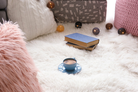 Soft white carpet with cup of coffee indoorsの写真素材
