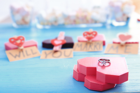 Beautiful composition with engagement ring on tableの写真素材