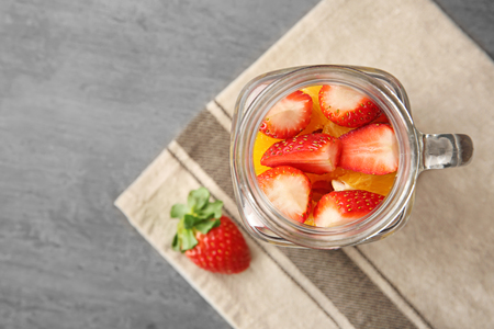Delicious fruit salad in mason jar on tableの写真素材