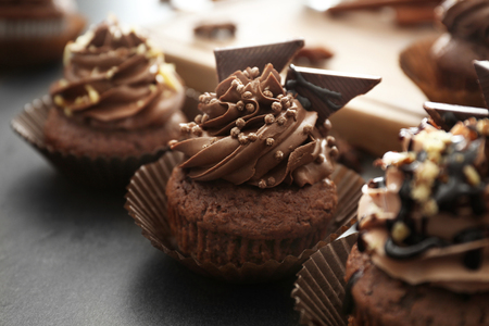Tasty chocolate cupcakes on table, closeupの写真素材
