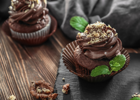 Tasty chocolate cupcake on slate plateの写真素材