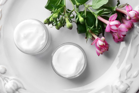 Jars of body cream on plateの写真素材