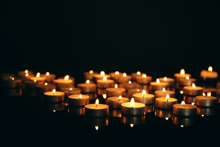 Burning candles on dark backgroundの写真素材