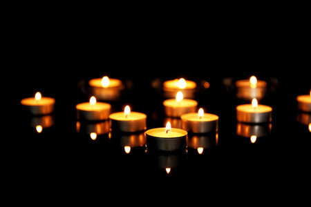 Burning candles on dark backgroundの写真素材