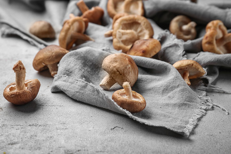 Raw shiitake mushrooms on table, closeup