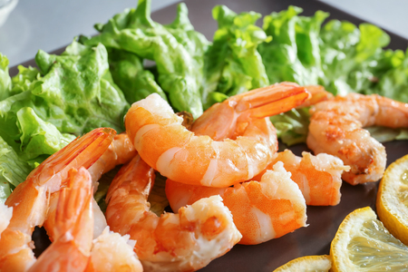 Delicious shrimps with lemon and lettuce, closeupの写真素材