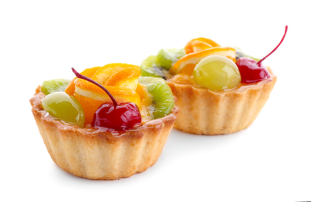 Tasty fruit tartlets on white backgroundの写真素材