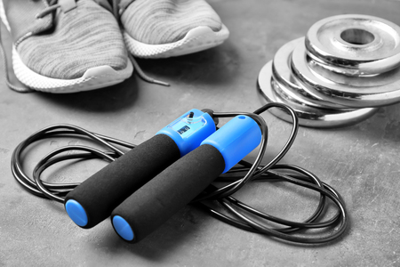 Composition with jumping rope on grey backgroundの写真素材