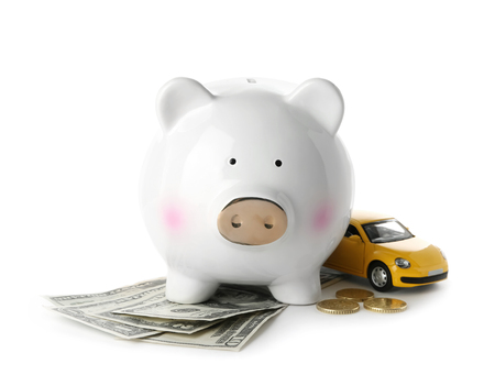 Piggy bank, money and toy on white background. Concept of buying new carの写真素材
