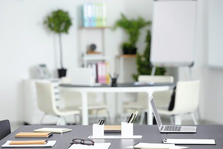 Table in modern office room prepared for business meeting