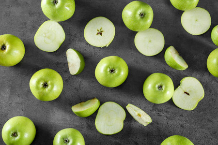 Fresh green apples on dark tableの写真素材