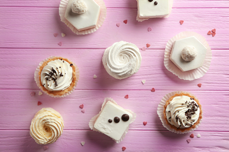 Assortment of tasty sweets on wooden backgroundの写真素材