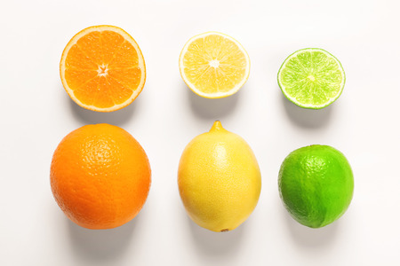 Composition with ripe lemon, orange and lime on white backgroundの写真素材
