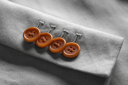 Sleeve of elegant custom-made suit, closeup