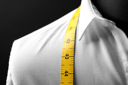 Elegant custom made shirt on mannequin against black background, closeupの写真素材
