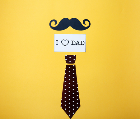 Composition with phrase I LOVE DAD for Father's Day on color backgroundの写真素材