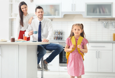 Cute little girl with backpack leaving for schoolの写真素材