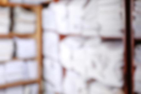 Blurred view of paper documents in archive