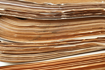 Stack of old documents in archive, closeup