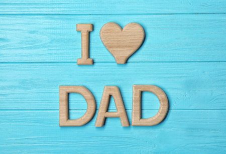 Composition with phrase I LOVE DAD for Father's Day on wooden backgroundの写真素材