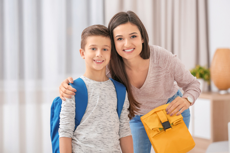 Young woman seeing her son off to schoolの写真素材