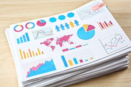 Stack of documents on wooden tableの写真素材