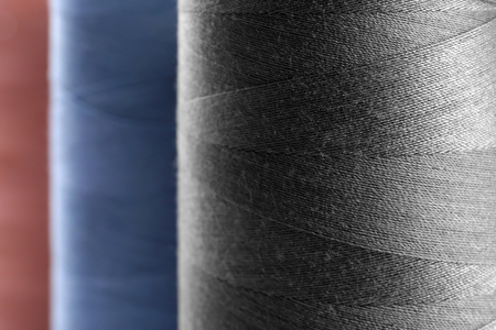 Dark grey thread bobbin, closeupの写真素材