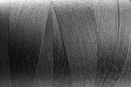 Dark grey thread bobbin, closeup