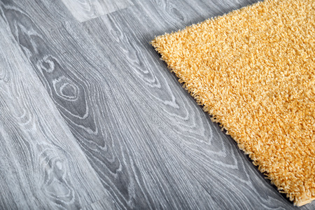 Yellow fluffy carpet on floorの写真素材