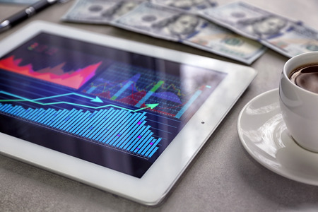 Tablet with stock data on tableの写真素材