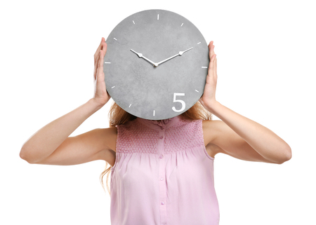 Female manager with clock on white backgroundの写真素材