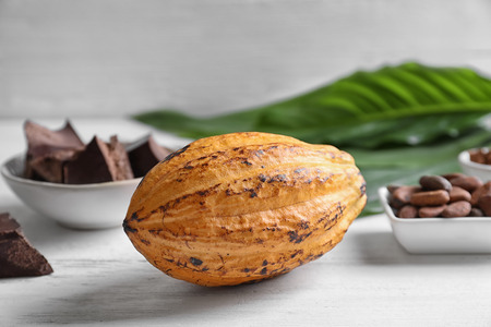 Ripe yellow cocoa pod on table, closeupの写真素材