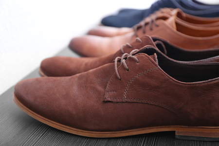 Stylish male shoes on shelf