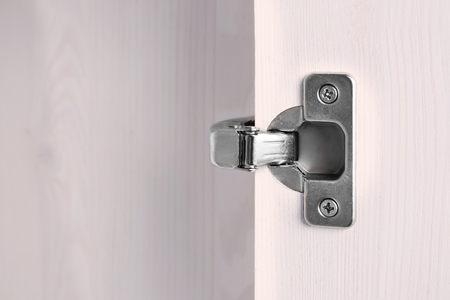 Metal hinges of wardrobe, closeup