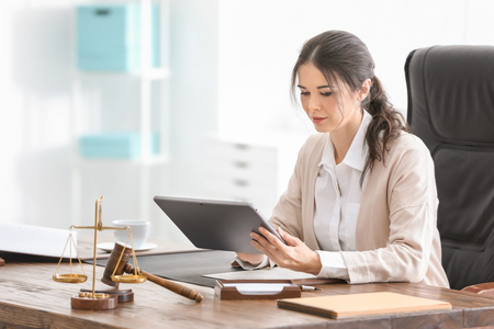 Young female notary working in officeの写真素材